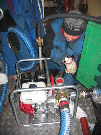 [20050511_41_MotoPump.jpg]
Jean monitoring the motopump sending water through the fire hose during a fire drill. The input water comes directly from a tank outside, which has water always maintained at warm temperature.