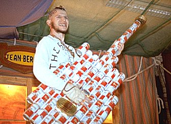 [GuitarJB.jpg]
As you see, everybody was well dressed for the midwinter... Yup, that's me, as leader of the punk band 'Les Skuas Noirs', with my Kronembourg guitar. Kro was the only beer available there... quantity in place of quality. Most people let their hair grow during autumn and shave into weird hairdos for the midwinter.