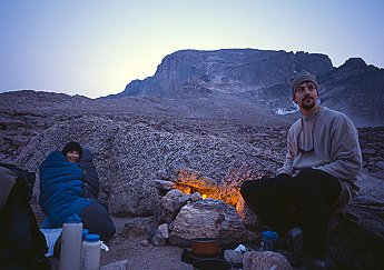 [BoulderfieldCamp.jpg]
Brad and Pina at the campsite of the Boulderfield, the night before our ascent. The diamond is visible by moonlight in the background. It's not a campfire but a flaring MSR.