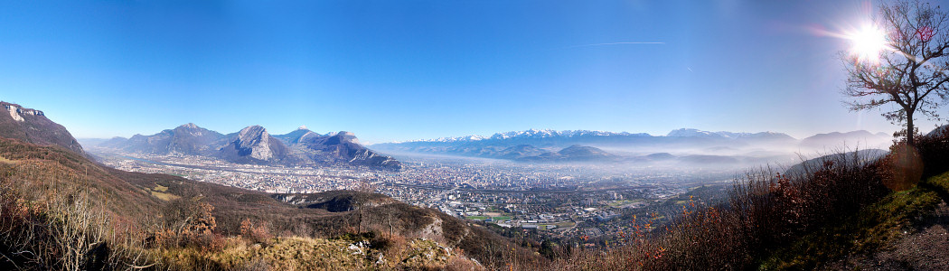 [20070113-Grenoble_Pano_.jpg]
The city of Grenoble seen from the Tour Sans Venin on the side of the Vercors. The range on the left is the Chartreuse with the Neron clearly visible as the large rock ridge in the middle. Belledonne covers the snowed mountains in the center. The Taillefer is the massive bulk just right of Belledonne.