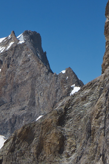 [20130727_135053_LaMeije_LesGrimpeursSeCachentPourOuvrir.jpg]
The tiny dot on the ledge, right in front of the snow patch, are climbers on the classic traverse of the Meije. Actually very slow or already planning for a bivy.