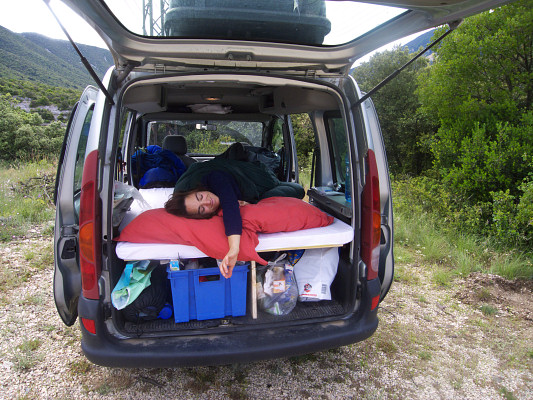 [20080608_080710_JennySleepKangoo.jpg]
The final version, with a 5cm thick foam mattress on top. I either roll the mattress with a strap or just let reach the bottom of the front seats (advantage, it covers whatever you have below). And yse, from the smile you can tell it's pretty comfortable...