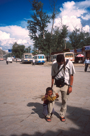 [LittleBeggar.jpg]
One of the many little beggars of the streets of Lhasa (but it's just about the same in Kathmandu). Starts by singing or playing something on a tiny guitar; if that doesn't work, grabs your leg and won't let go...