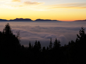 Sunset and sea of clouds over the city of Grenoble, as seen from the Taillefer