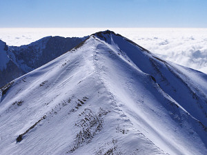 Skiers on the summit of Vallon Pierra