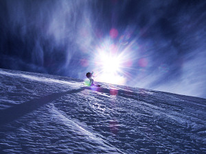 Skiing down the frozen slope of the Rosoire Glacier