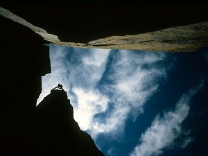 Jenny climbing a pillar in an alcove. Eagle Lake, Lake Tahoe