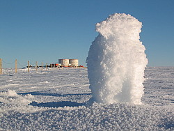 20050127_32_PenguinSnowed - Snow scuplture of a penguin, with the Concordia buildings in the background.