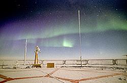 AuroraRoofLow08 - Green and purple aurora in the Antarctic night.