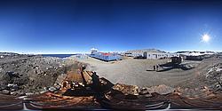 BTNplaceBPano_ - Panoramic view of the Mario Zuchelli Station, taken from between the buildings, the shore and the helicopter pad. From Left to right: Helicopter and Mt Melbourne, main station building, garages and workshops, pinguinatolo and containers.
[ Click to go to the page where that image comes from ]