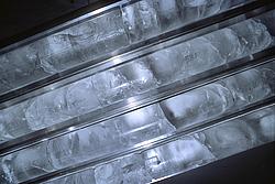 IceCores - A scientist cutting up and examining ice cores in the 'cold lab'.
[ Click to go to the page where that image comes from ]