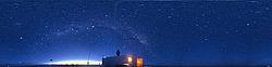 LidarBeam1FVW - An image of the Lidar beam shooting at the sky from the Atmosphere Science container, with the Milky Way and the two Magellanic clouds clearly visible above (one is on the far right and one on the left).
[ Click to go to the page where that image comes from ]