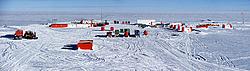 TraverseSummerCampPano_ - The land Traverse after its arrival in Concordia: the Challengers with the 'living' and 'energy' modules are parked on the left, while the newly delivered trailers and containers are in the center of the plaza.
[ Click to go to the page where that image comes from ]