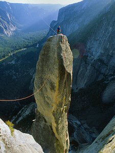 Climber getting ready for the tyrolean traverse of the Lost Arrow